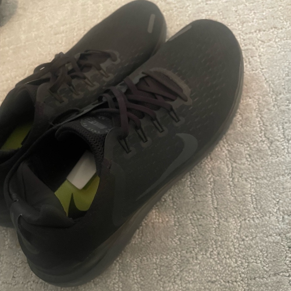 Black Nike running shoes